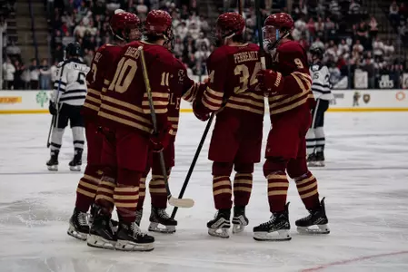 Men's Hockey celebrating power play goal against UNH