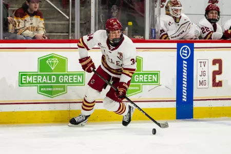 Gabe Perreault skating with the puck against Merrimack