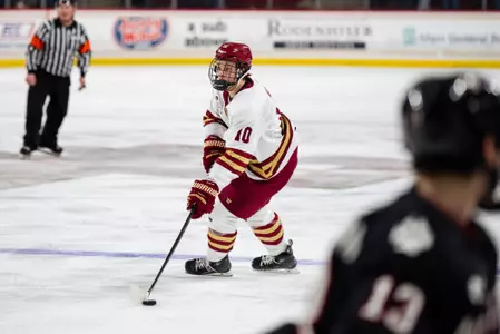 James Hagens skating with puck against Northeastern in HEA Quarterfinals