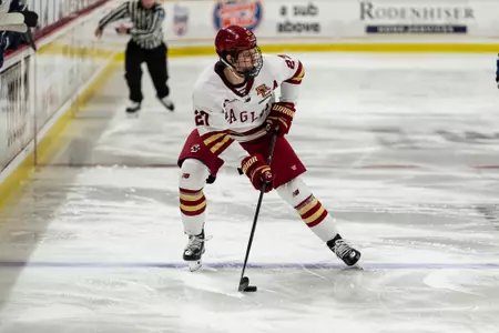 Connor Joyce skating with the puck against UNH