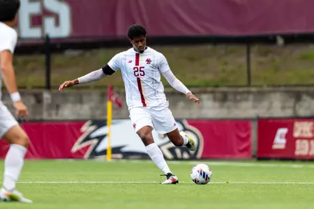 CJ Williams looking to make a long pass against Binghamton
