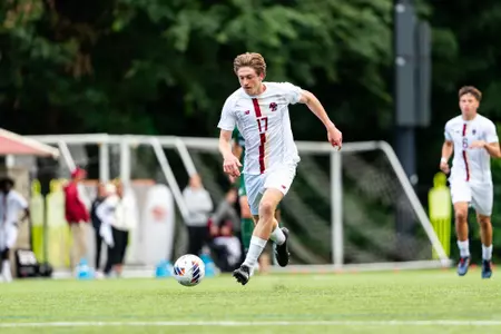 Russell Brown runs with the ball against Binghamton