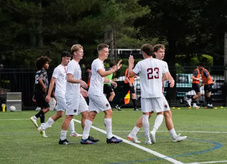 Men's Soccer celebrates a goal in win over Dean