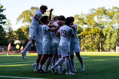 Men's Soccer celebrating goal against Northeastern