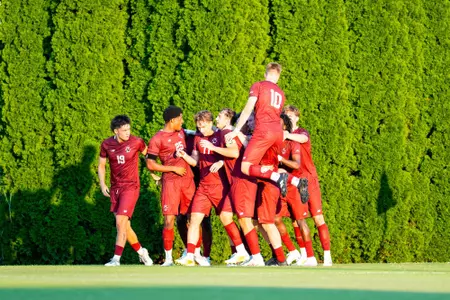 Men's Soccer celebrates penalty kick goal against Virginia Tech