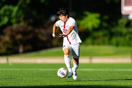 Dylan Mafong running with the ball against Northeastern