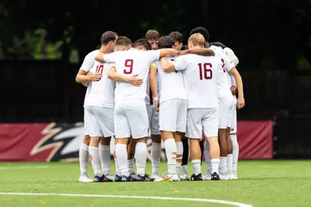 Men's soccer huddle against Cal