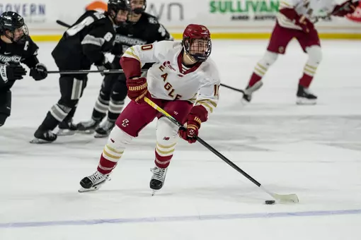 James Hagens skating with the puck against Providence