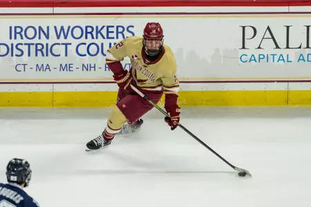 Jake Sondreal skating with the puck against UNH