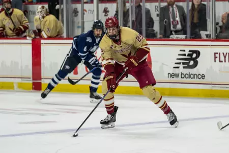 Dean Letourneau skating with the puck against UNH