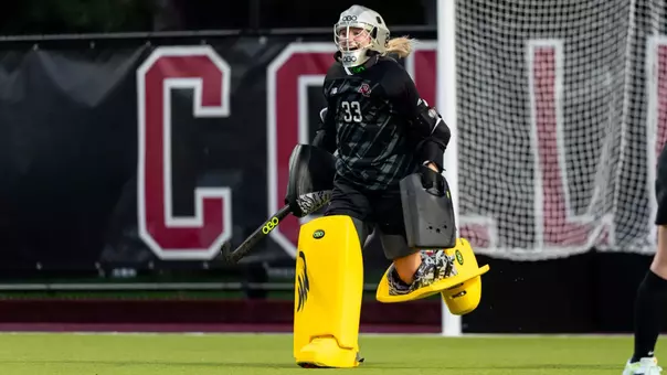 Charlotte Kramer running to her team, celebrating after a win