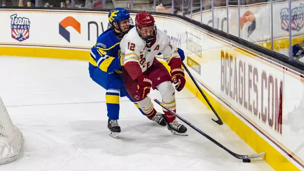 Jake Sondreal fighting for the puck against Alaska