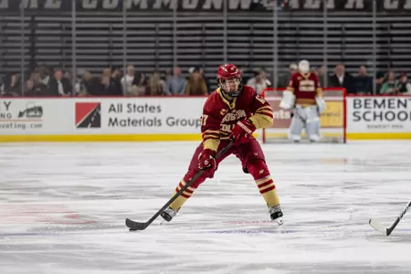 Aram Minnetian looking to pass the puck against UMass