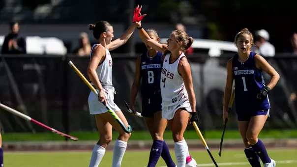 Laila Rosenquest and Alex De Cain high five against Northwestern
