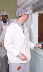 Men's Basketball Helps Out During The Holiday Season Image