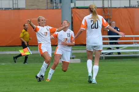 Leah Runkle (6) & Kara Ross (19) congratulate Skylar Fleak (20)