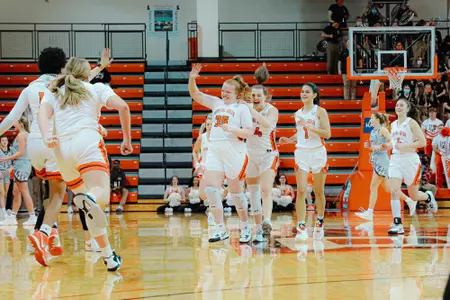 Kadie Hempfling is congratulated after surpassing 1,000 career points