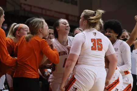 The Falcons congratulate Madisen Parker after her 'and-1' three-pointer