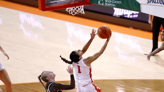 Amy Velasco scores 2 of her game-high 22 points on a reverse layup