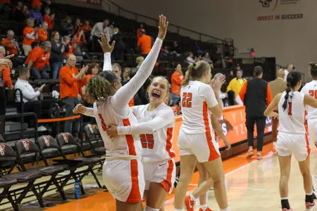 Johnea Donahue (left) and Lexi Fleming celebrate the win over Xavier - Dec. 7, 2024