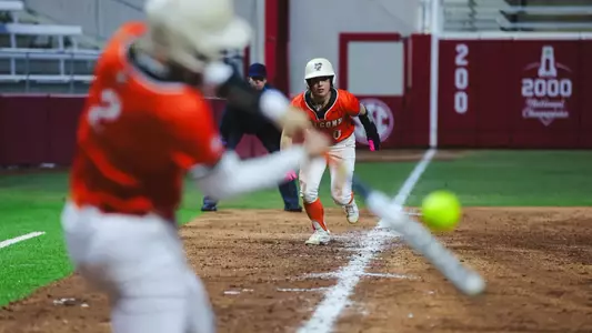 Addie Martin scores on a Hannah Hunt base hit v Abilene Christian