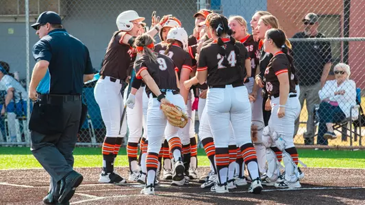 Falcons celebrate a home run by Kendal Mathews (19) at Buffalo | March 14, 2025