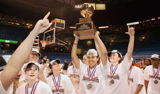 Amber Flynn hoists the trophy