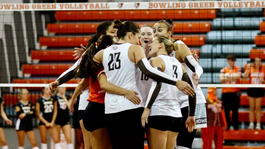 Team huddles after a point against Northern Kentucky at the Stroh Center.