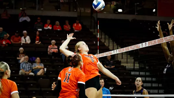 Ceclily Waynar hits ball over net against American in the Stroh Center