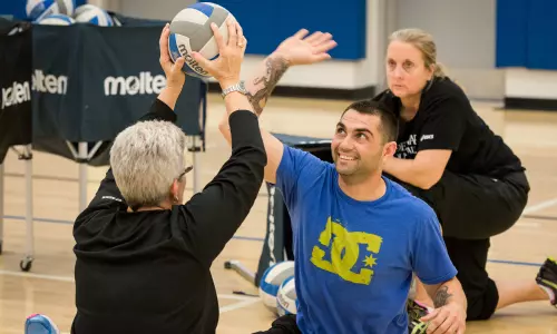 University of Delaware Volleyball Squad Helps Wounded Warrior Athlete Prepare for Warrior Games