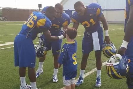 Blue Hens Featured for Relationship with Five-Year-Old "Superhero"