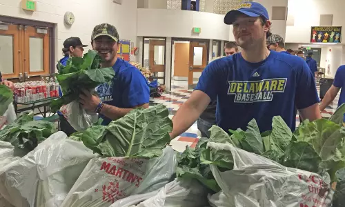 Delaware Baseball Squad Steps to the Plate to Assist Maryland Food Bank