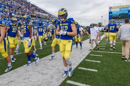 Andrew Pawlowski walking on sideline