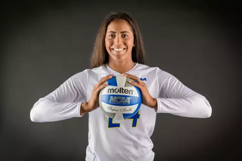 Posed photos of 2019 Volleyball players on black seamless for Sports Information / Athletics marketing.