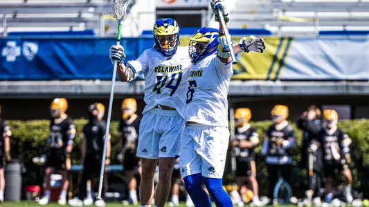 Charlie Kitchen and Joe Speers celebrate after beating Towson
