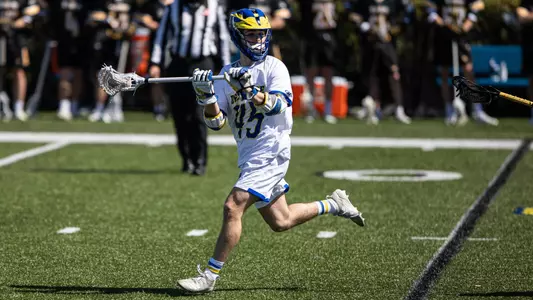Cam Acchione looks to pass the ball against Towson