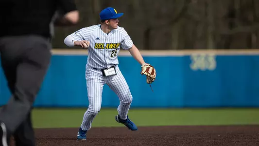 Joey Loynd fields a grounder in a game against Fordham