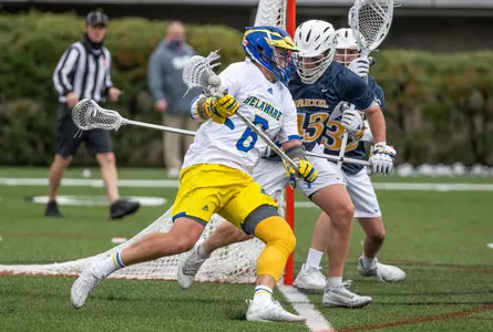 Charlie Kitchen fights past a Drexel defender