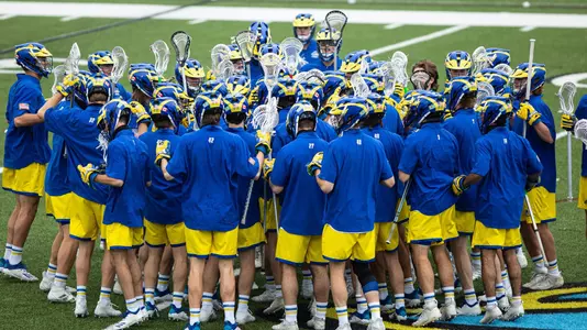 Men's lacrosse huddles as a team before the home game against Drexel.