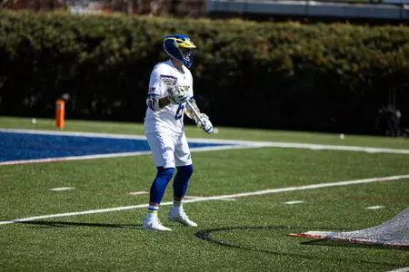 Charlie Kitchen waits behind the crease with the ball in his stick