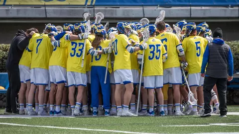 Men's Lacrosse huddles pregame versus Fairfield