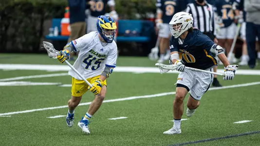 Cam Acchione looks to take the ball past a Drexel defender