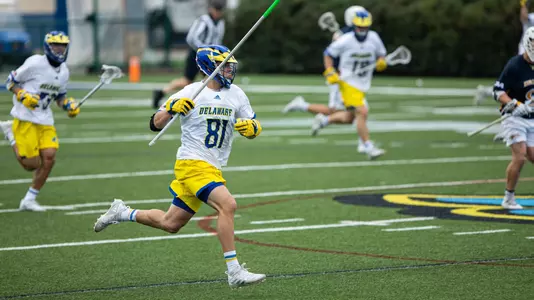 Owen Grants runs down the field with the ball against Drexel