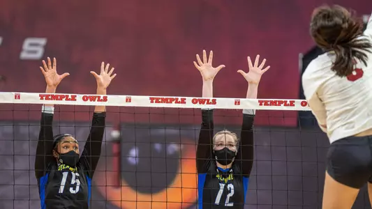 Lauryn Richardson and Grace Underwood go up for a block against Temple