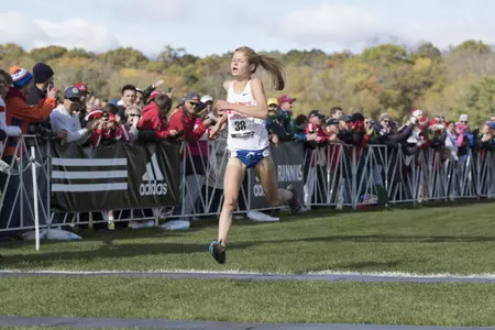 Allie Ostrander crossing the finish line