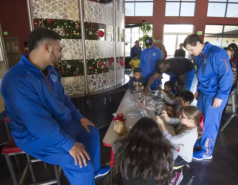 Bronco players visiting with the kids at Ronald McDonald Hous