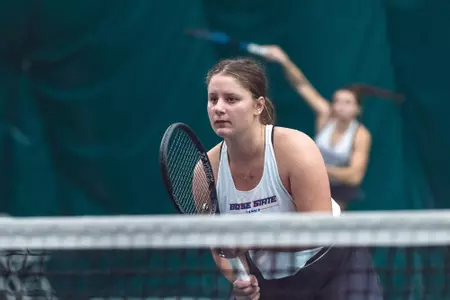 Holly Stewart awaits a serve.