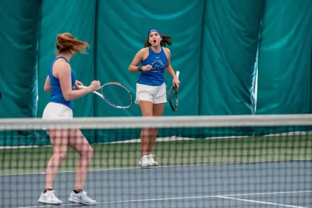 Joana Baptista and Shauna Heffernan celebrate a point.