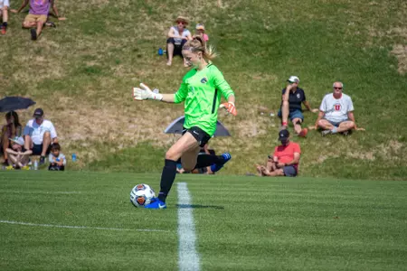 Boise State soccer player Sydney Smith passes the ball to a teammate.