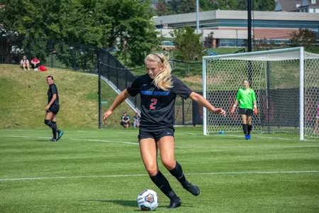 Boise State soccer player Jocelyn Stephens passes the ball to a teammate.